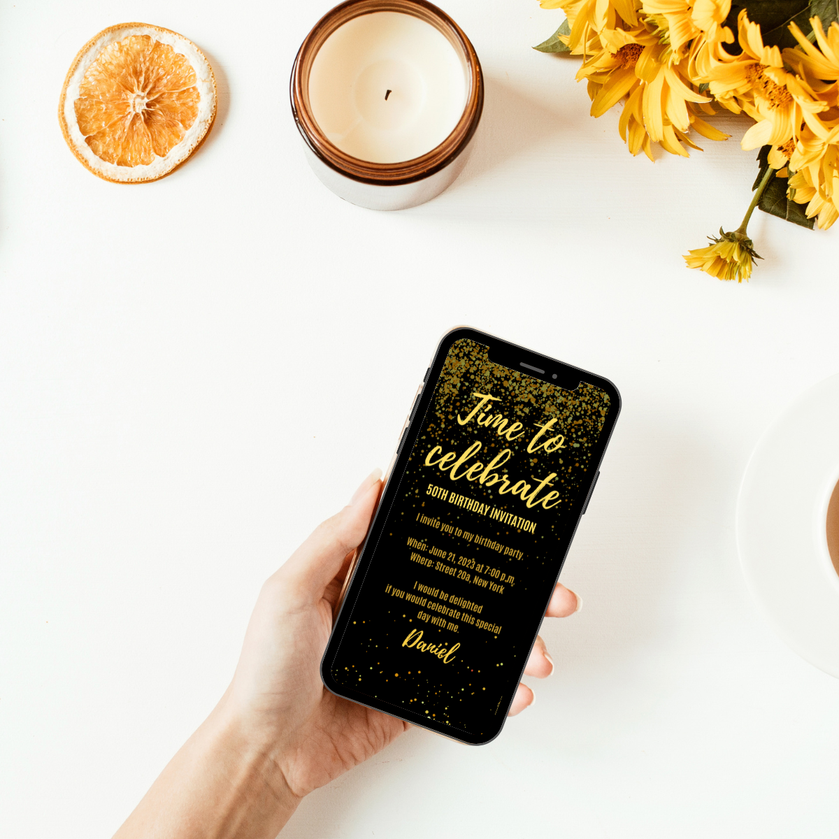 Birthday invitation card in black and gold confetti.